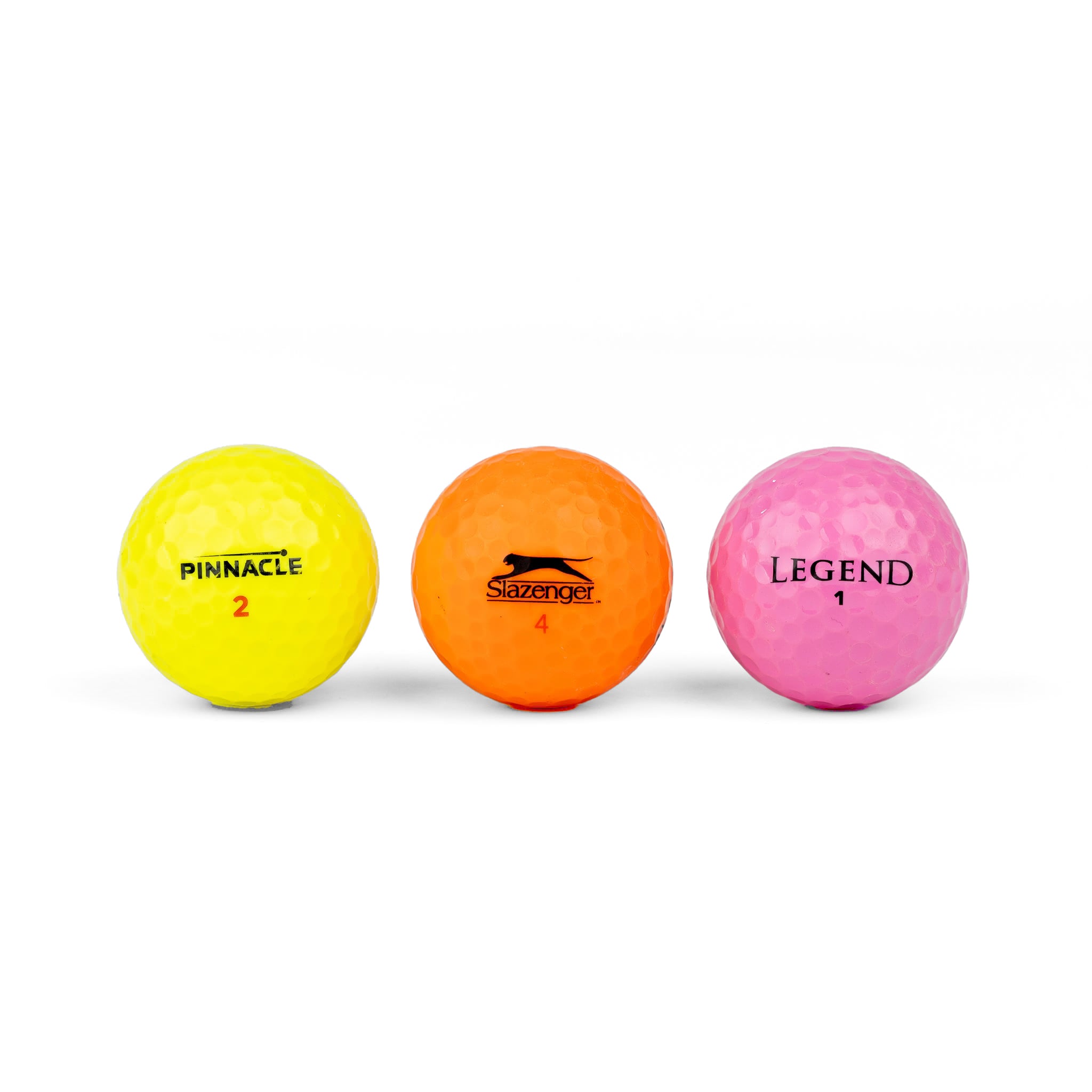 Gekleurde golfballen (roze, oranje, geel)