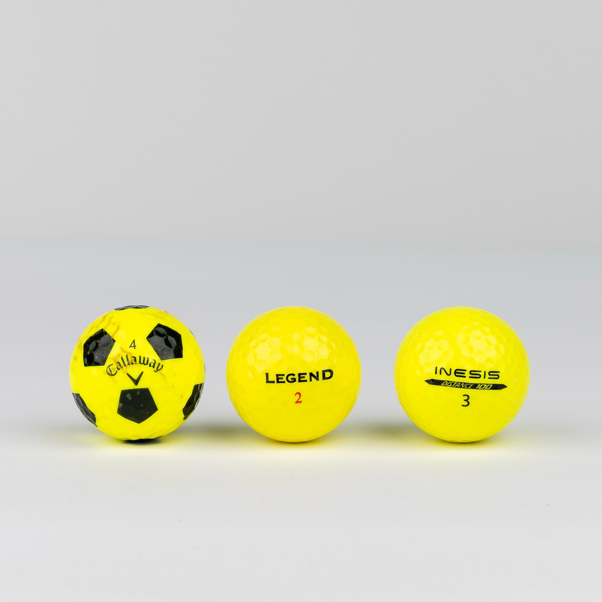 Gekleurde golfballen (roze, oranje, geel)