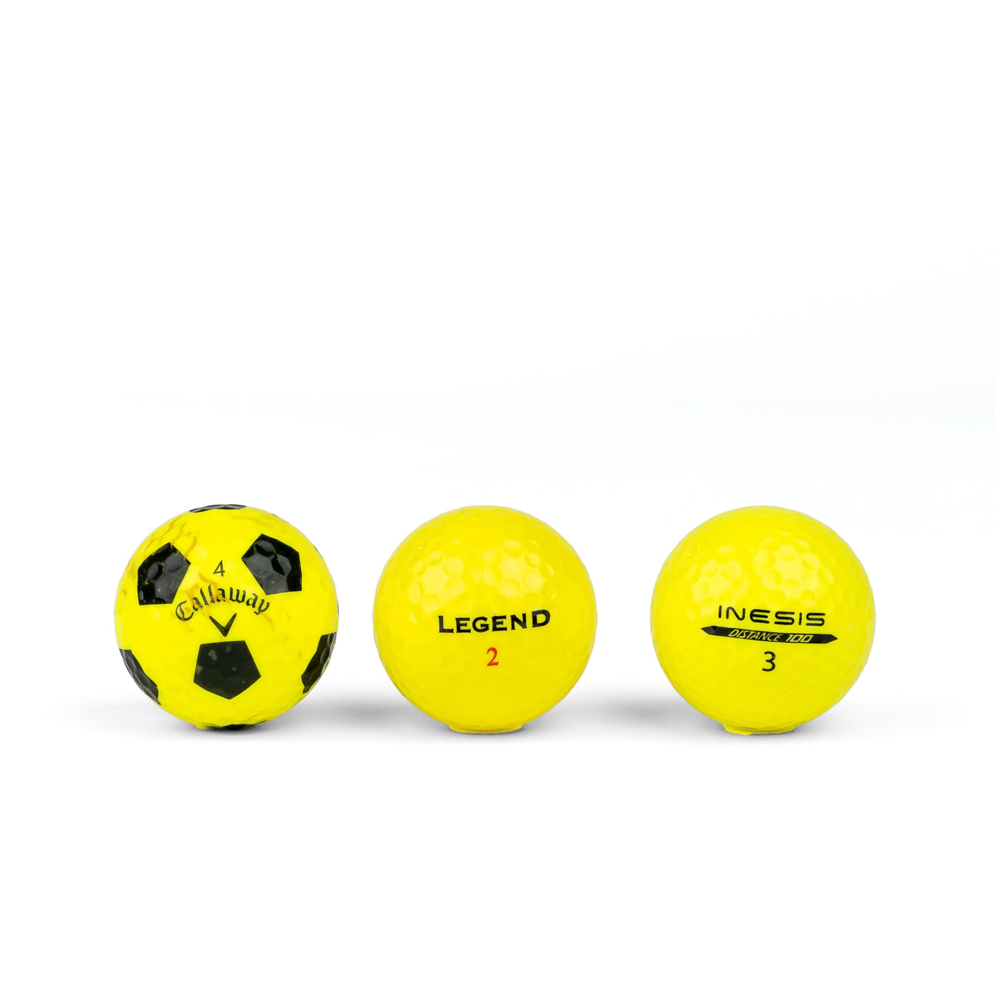 Gekleurde golfballen (roze, oranje, geel)